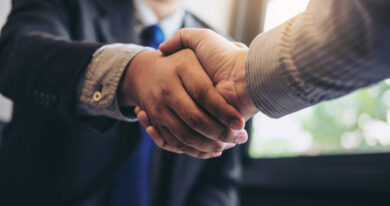 Two business men shaking hands during a meeting to sign agreement and become a business partner, enterprises, companies, confident, success dealing, contract between their firms.